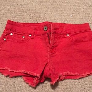 Red Jean shorts.
